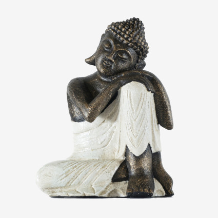 Figure de Bouddha blanche au repos